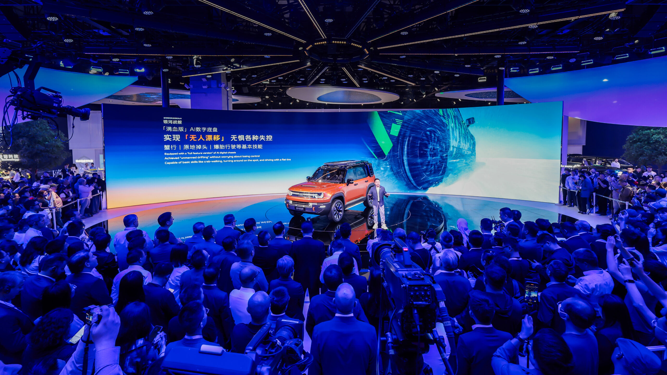 CEO of Geely Auto delivering a keynote speech scaled